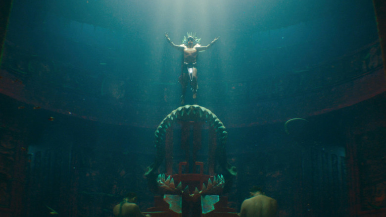 Namor floats to throne underwater with arms open