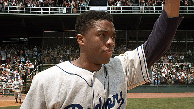 Boseman salutes the crowd as Jackie Robinson