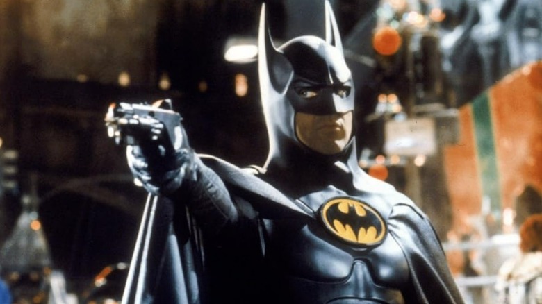 Batman points a grappling gun in "Batman Returns" (1992)