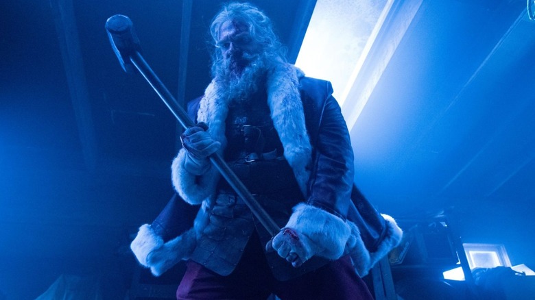 Santa raises a sledgehammer in "Violent Night" (2022)