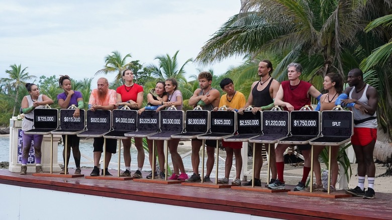 Contestants lined up with briefcases on Deal or No Deal Island (2024)