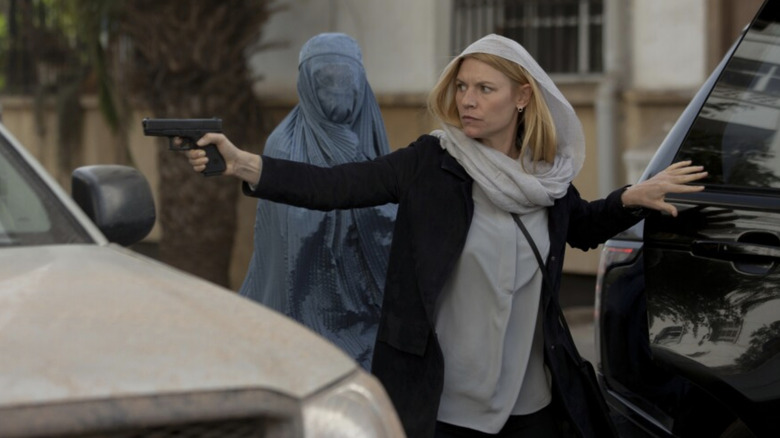 Carrie Mathison pulls a gun on the street on "Homeland" (2011-2020)