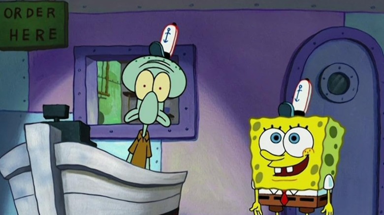 Squidward looking afraid while SpongeBob smiles in the dark Krusty Krab after closing time on SpongeBob SquarePants