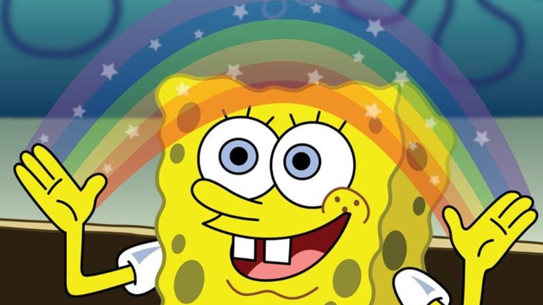 Spongebob making a star-spangled rainbow with his hands while smiling on SpongeBob SquarePants