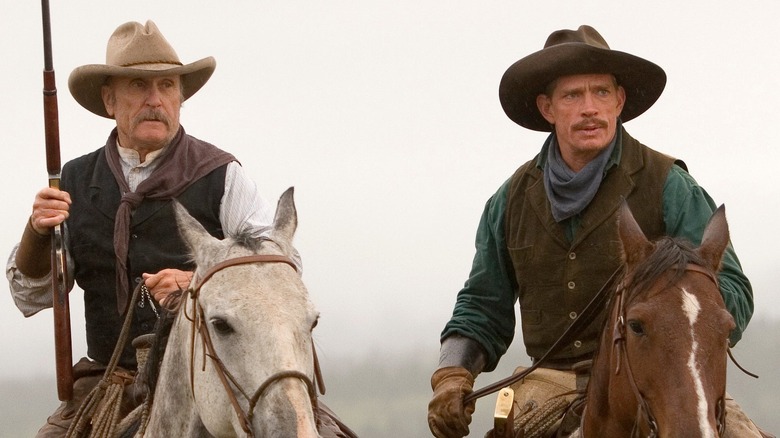 Prentice and Tom ride on horseback in "Broken Trail" (2006)