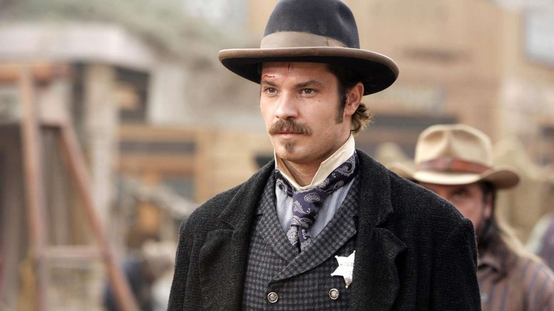 Bullock walks through the title town in "Deadwood" (2004-2006)