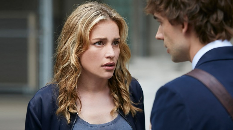 Annie facing Auggie while standing outside in "Covert Affairs."