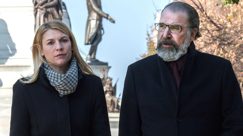 Carrie and Saul walking by some statues in "Homeland."