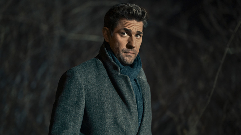 Jack standing outside in a coat and scarf in "Jack Ryan."