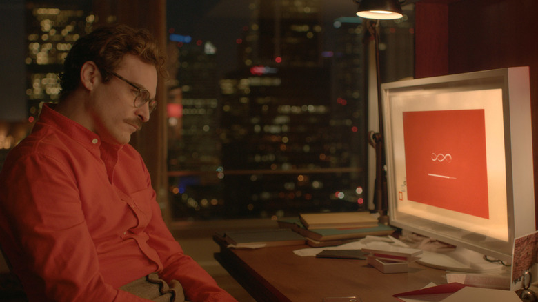 Joaquin Phoenix staring at his computer in "Her"