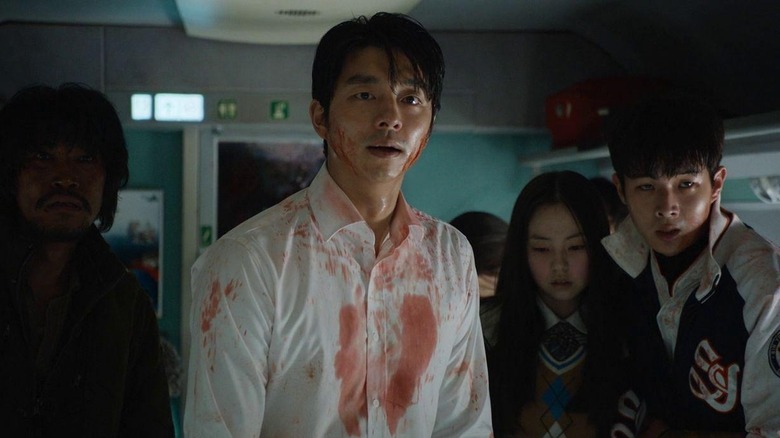 Seok-woo wearing bloody shirt