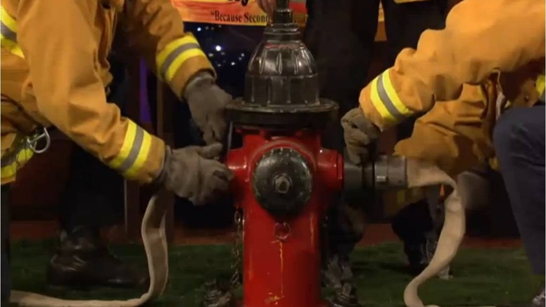 Firemen next to fire hydrant