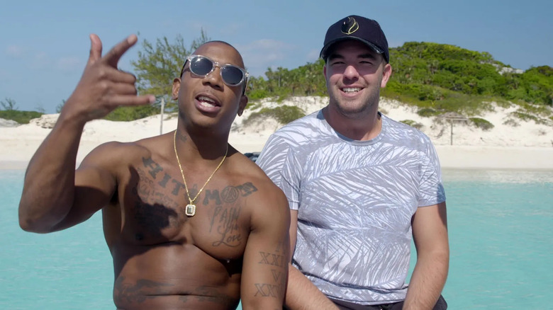 Ja Rule and Billy McFarland smile 