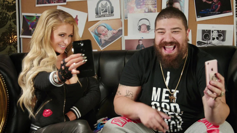 Paris Hilton and Josh Ostrovsky show phones