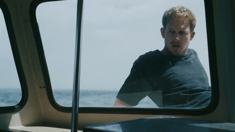 Man sitting on fishing boat