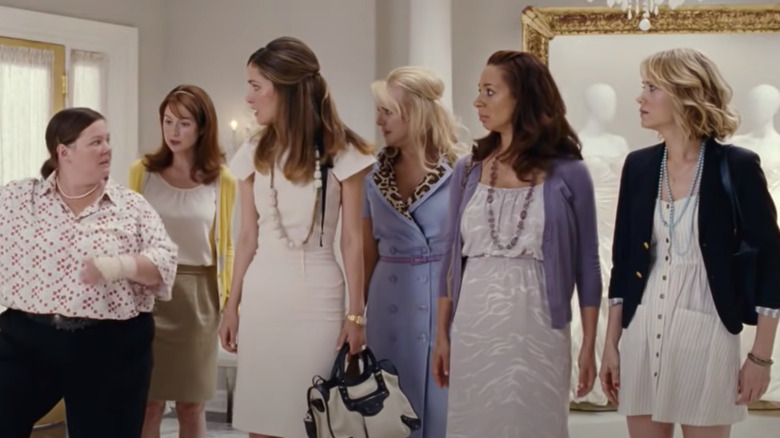 The bridesmaids look at Melissa McCarthy