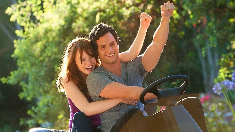 Olive and Todd on a riding lawnmower in "Easy A."