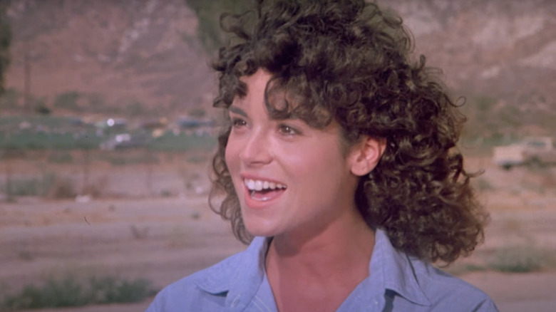 Betsy Russell smiles in "Tomboy"