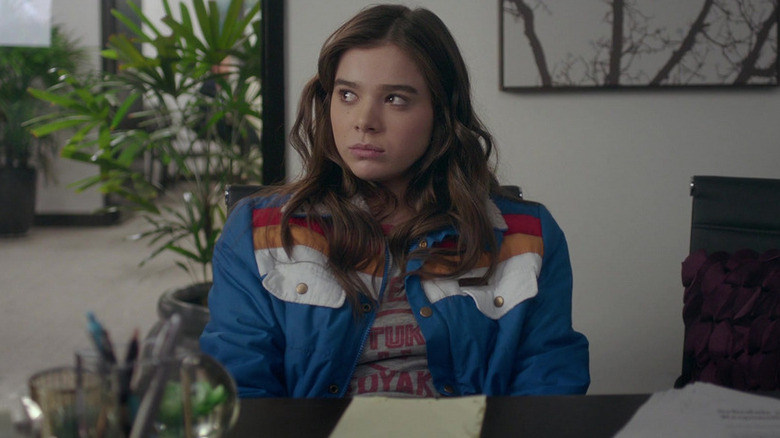 Nadine sits in an office in "The Edge of Seventeen" (2016)