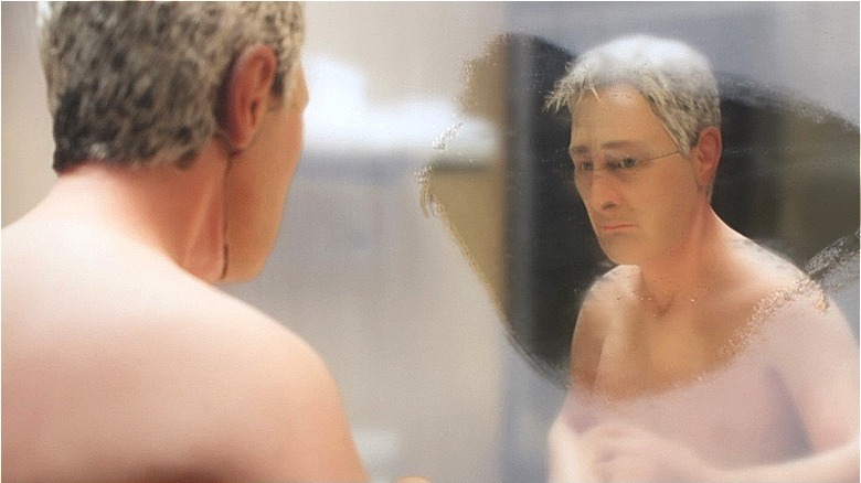 Michael Stone looking into a mirror