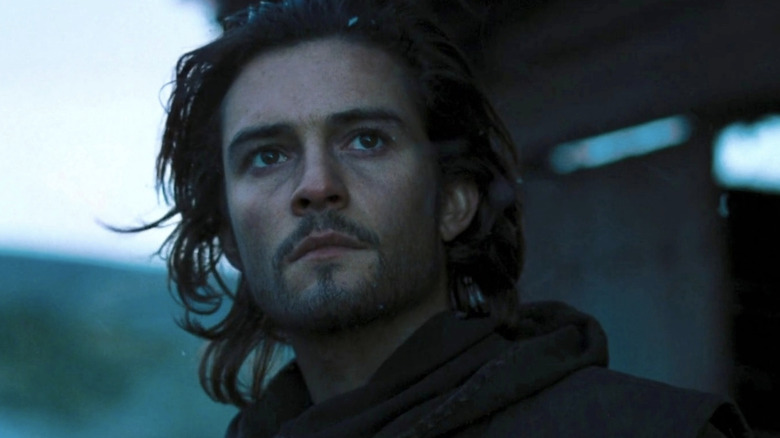 Balian of Ibelin looks on in the darkness in Kingdom of Heaven (2005)