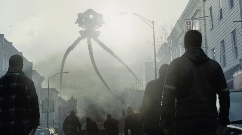 A tripod steps out onto the street in War of the Worlds (2005)