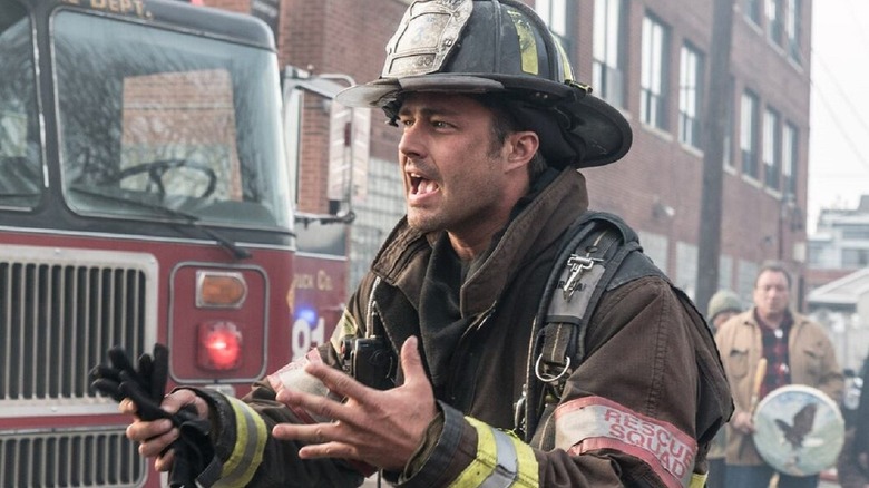 Kelly Severide in uniform at a fire incident