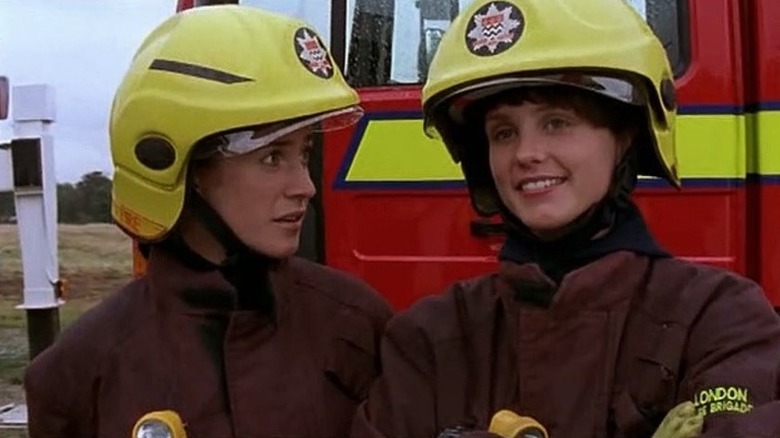 Two firefighters near a fire truck in "London's Burning"