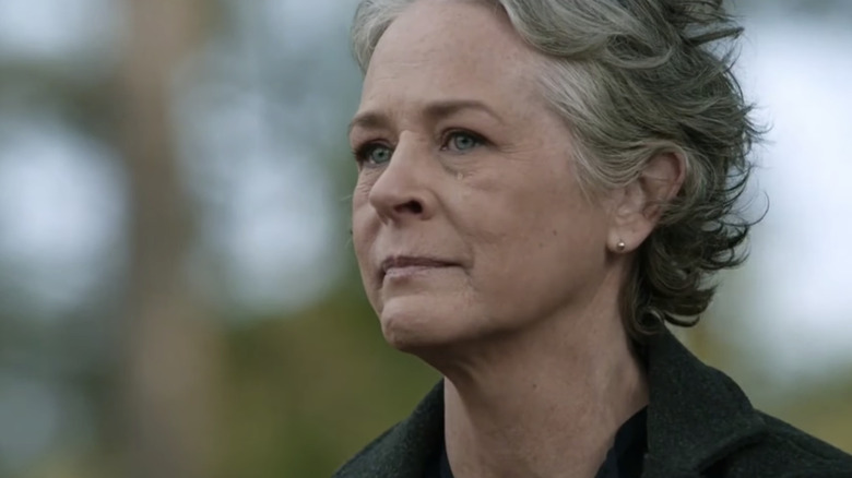 Carol Peletier smiling stoically