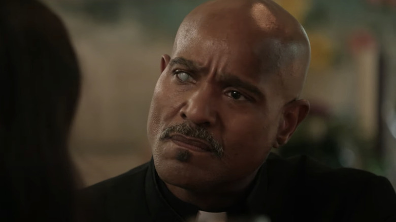 Father Gabriel Stokes tilts head