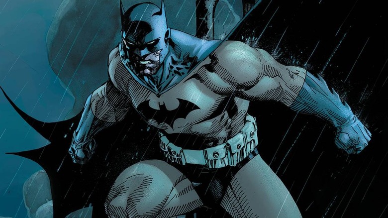 Batman standing in the rain