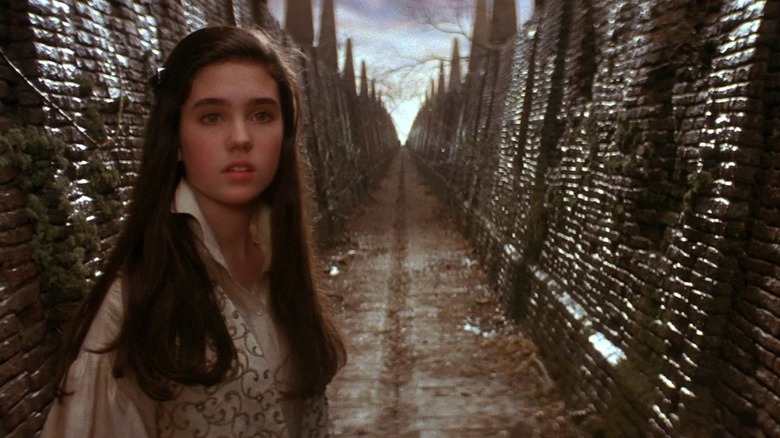 Jennifer Connelly in the labyrinth, looking on