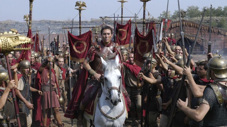 Julius Caesar riding with his army