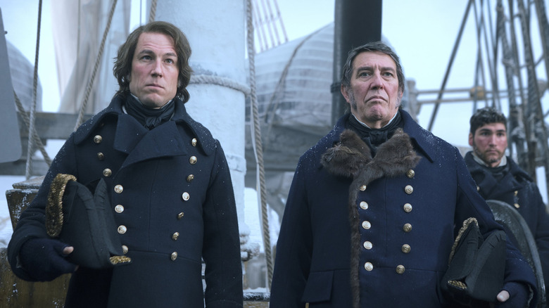 Fitzjames and Franklin standing on deck