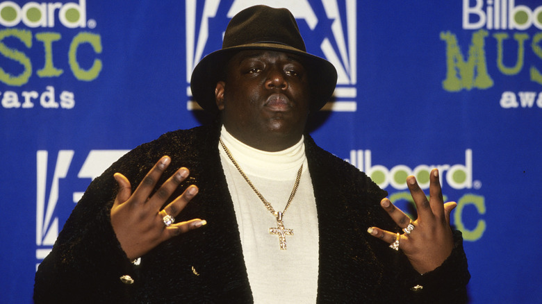 The Notorious B.I.G. posing on the red carpet at the 1995 Billboard Music Awards