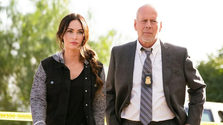 Megan Fox and Bruce Willis look off to side