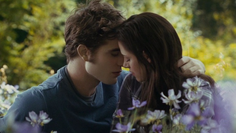 Edward and Bella kissing in meadow