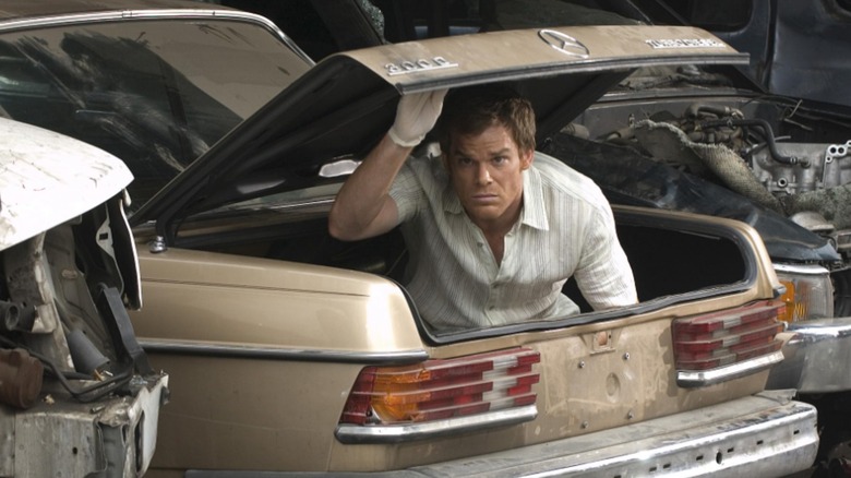 Dexter peers out of a trunk on "Dexter"