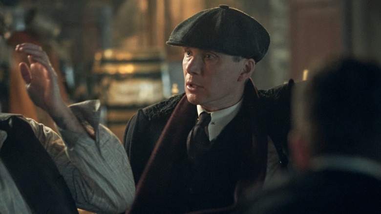 Tommy glares at someone in "Peaky Blinders"