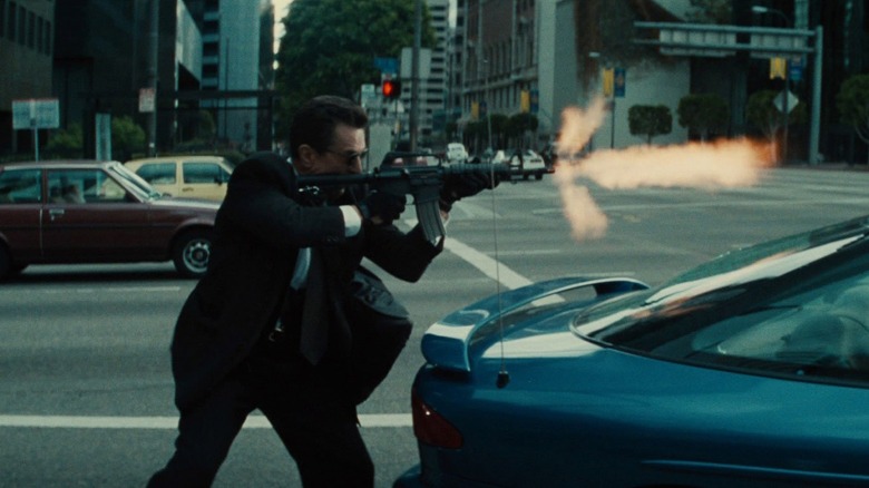 Neil McCauley shooting an assault rifle in the street in "Heat"