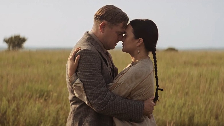 Married couple Ernest and Mollie Burkhart embracing in "Killers of the Flower Moon"