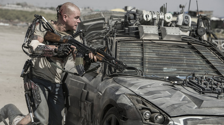 Max Da Costa wields a gun in "Elysium" (2013)