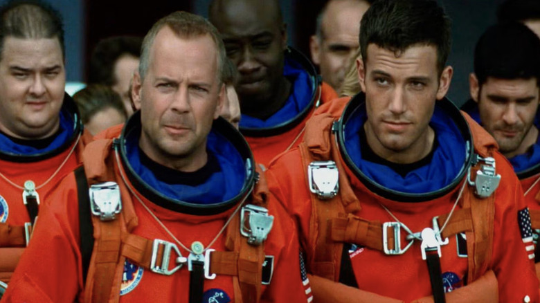 Harry Stamper, A.J. Frost, and the other astronauts congregate in "Armageddon" (1998)