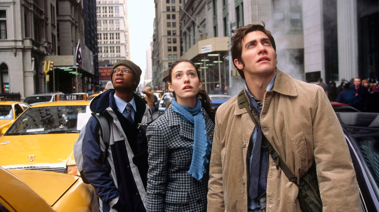 Brian Parks, Laura Chapman, and Sam Hall outside looking up in "The Day After Tomorrow"