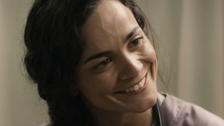 Alice Braga cocks head and smiles