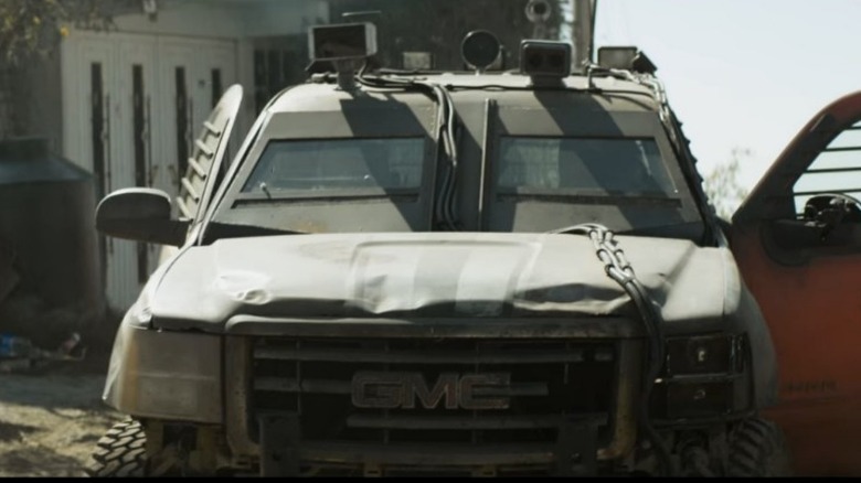 Busted GMC car with chains and speakers