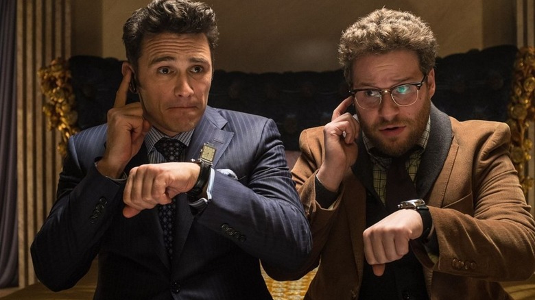 James Franco and Seth Rogen listen to watches