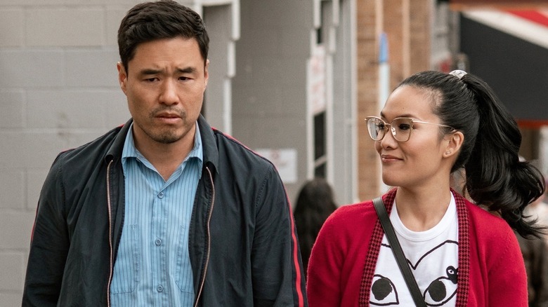 Marcus and Sasha walking down a street together