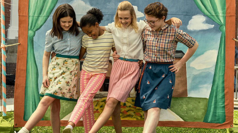 Margaret and her friends posing for a photo at the end-of-year school carnival