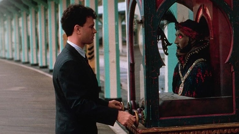 Josh, as an adult, attempting to use an antique fortuneteller machine to return to his 13-year-old self